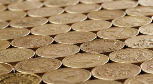 lots of one pound coins laid out flat