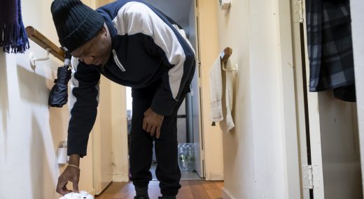 Man turning on heater