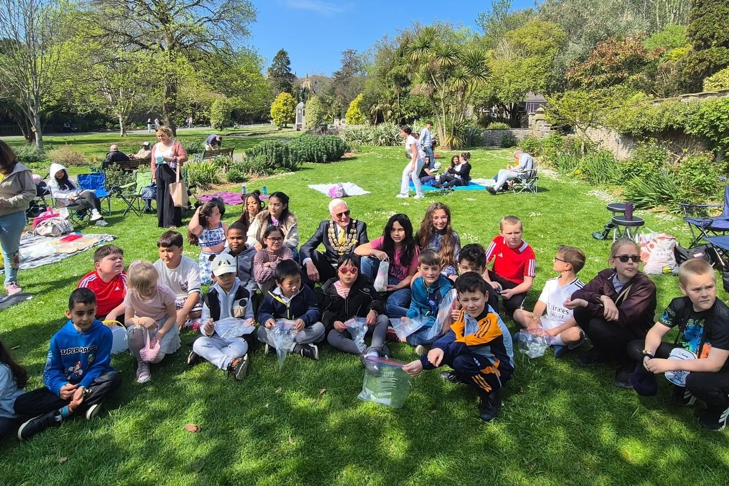 A group of people having a picnic in Grove Park, Weston-super-Mare.