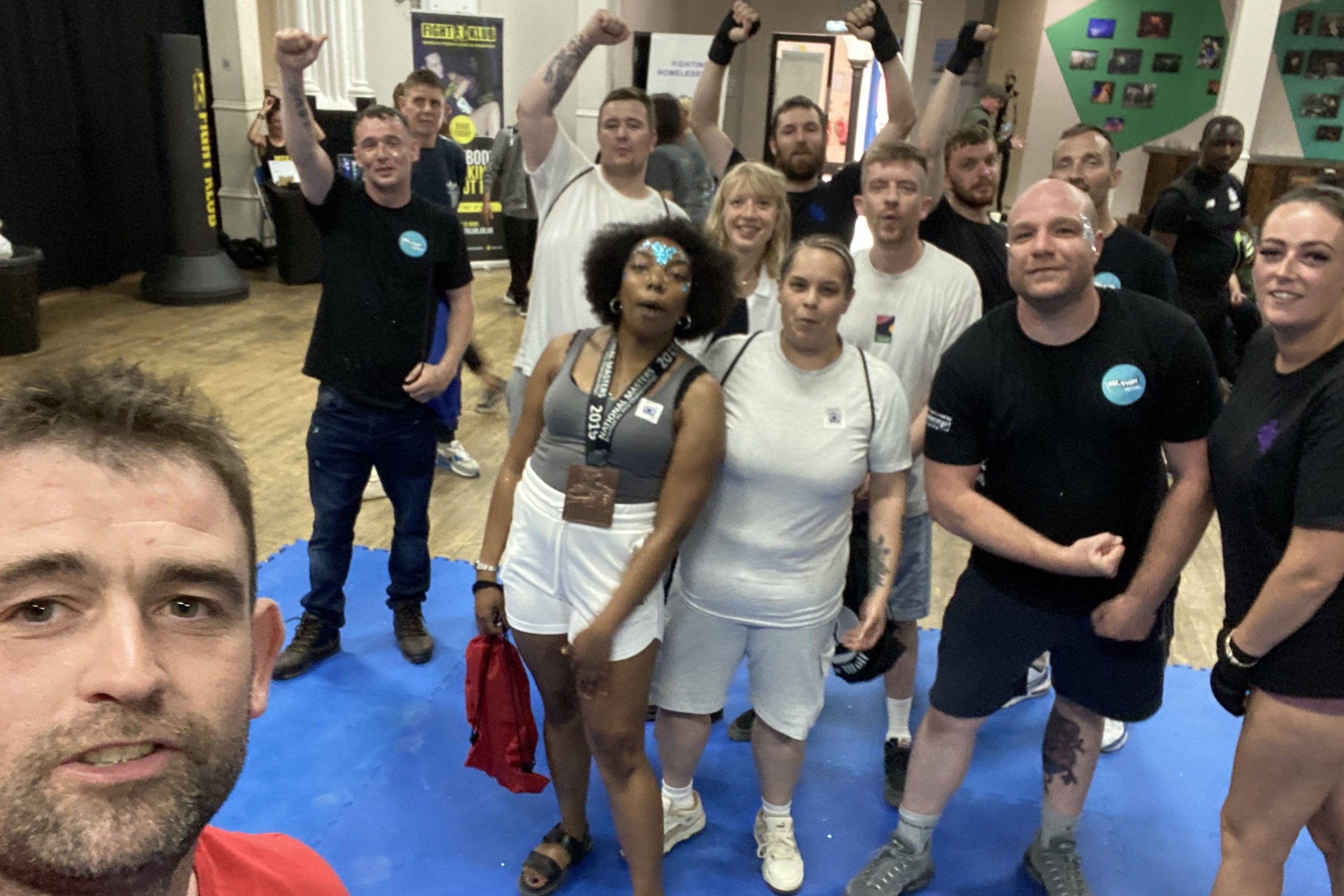 Group of men and women at a Sober Wolf fitness class.